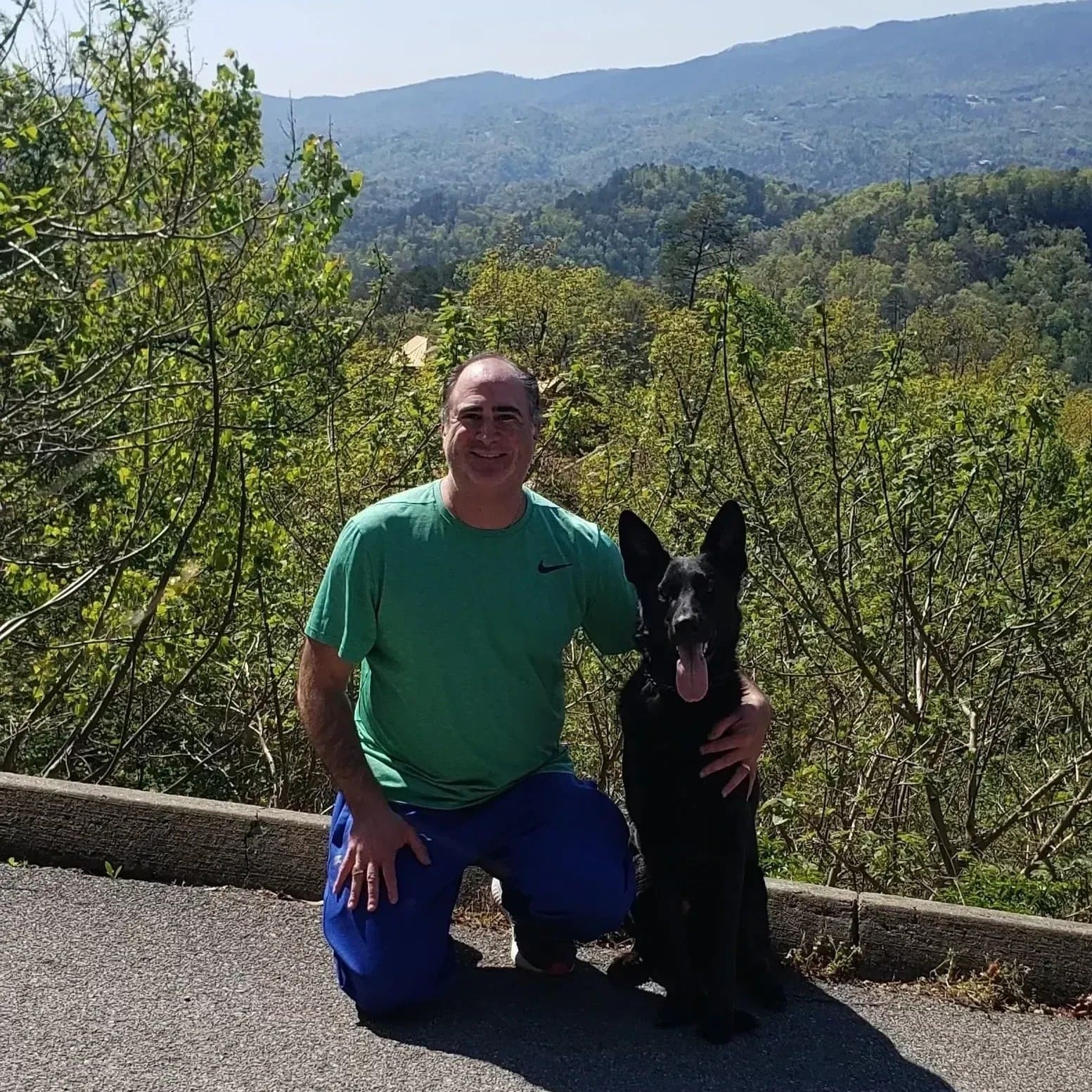 Rich training a dog outside off leash